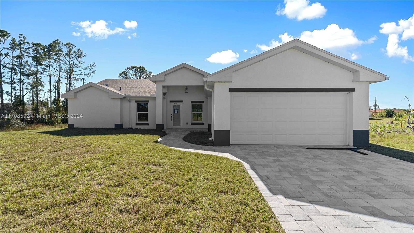 Welcome to this stunning brand new construction home in the heart of Lehigh Acres, FL !
