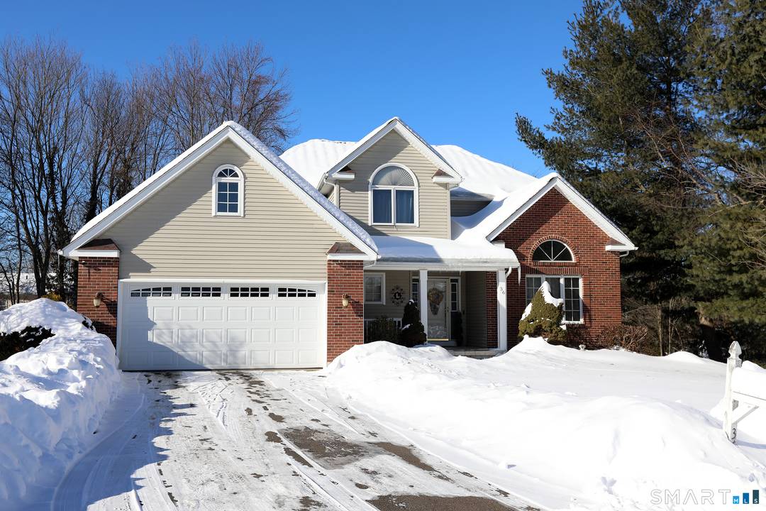 This charming home, nestled at the end of a cul de sac in Manchester, boasts a spacious two car garage, a large open foyer leading to the dining room, a ...