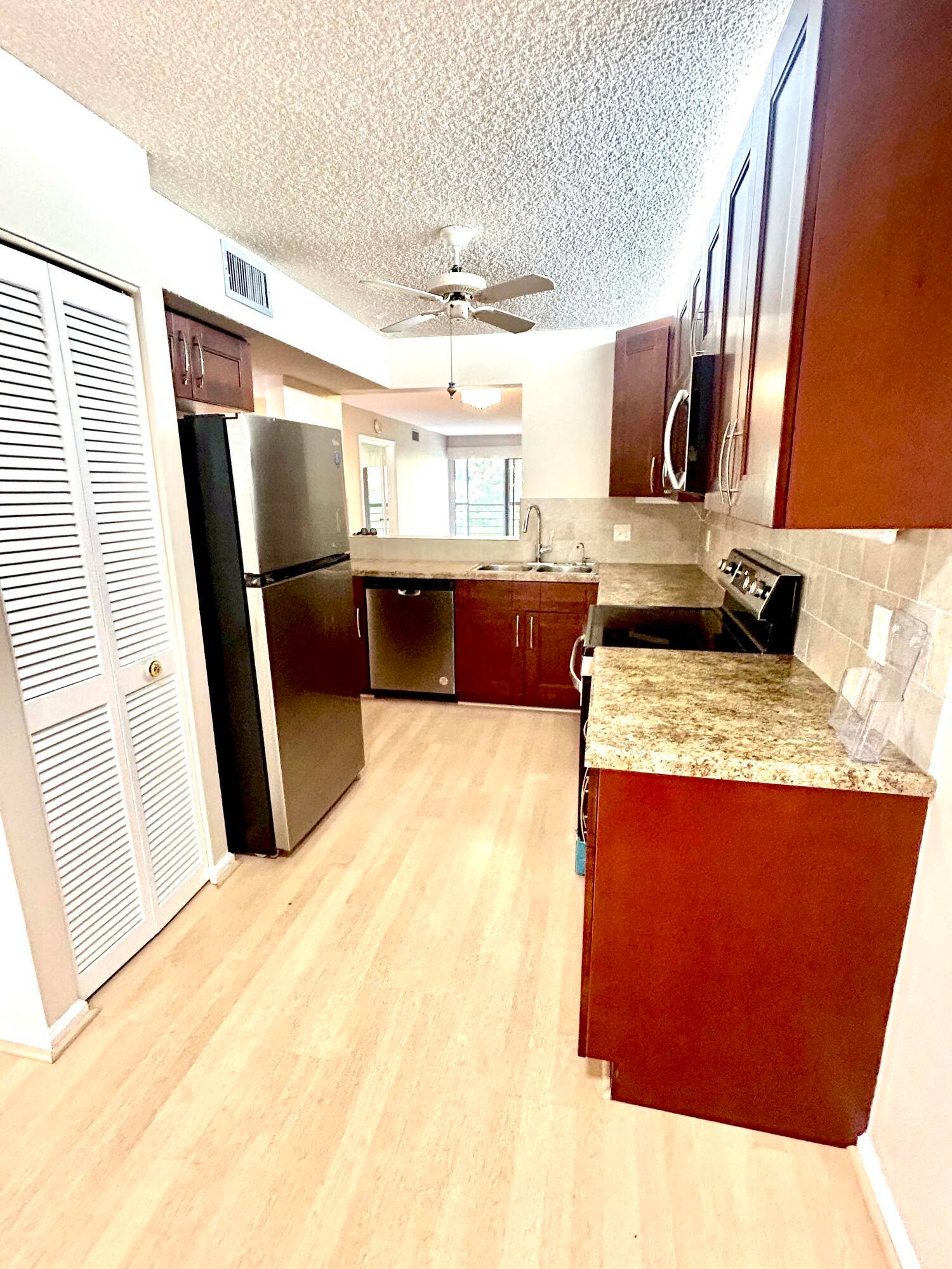 NEWER KITCHEN AND BATHROOMS IN THIS UPDATED 2 2 SECOND FLOOR ELEVATOR BUILDING CONDO !