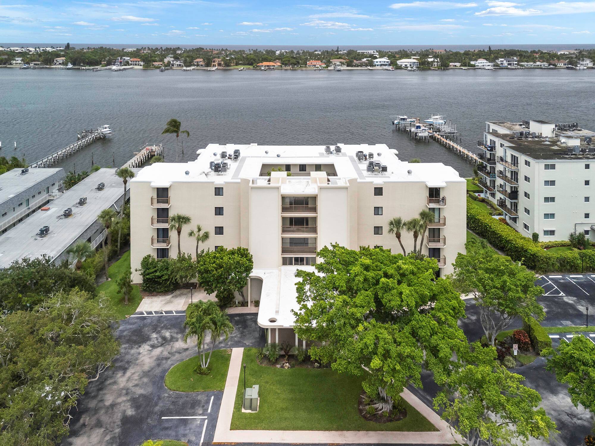 Discover the convenience and comfort of this rare first floor 2 bedroom, 2 bathroom condo in the boutique Hidden Banyan community.