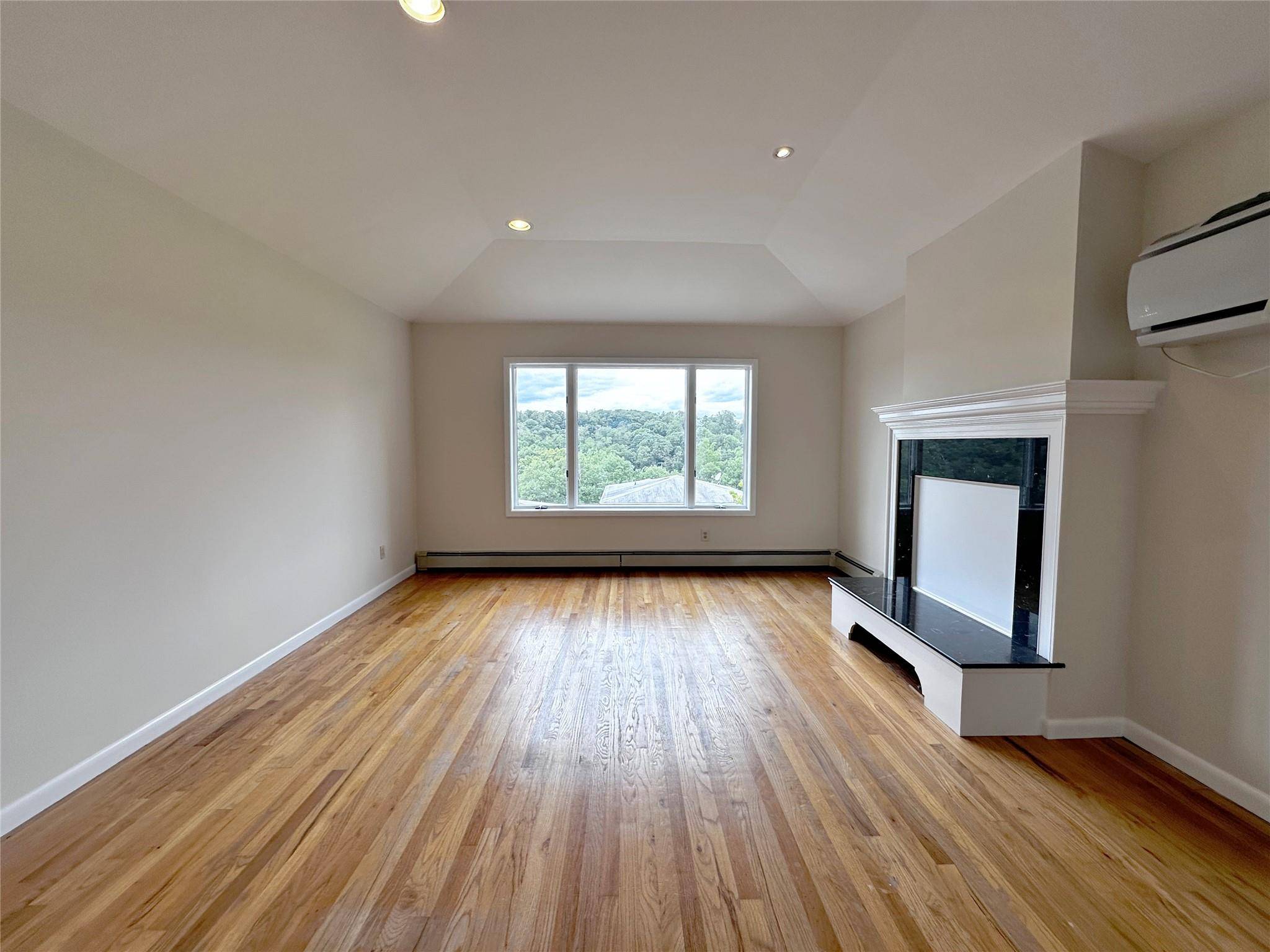 Welcome home to this freshly painted, second floor gem offering the perfect blend of comfort, charm, and elevated treetop views.