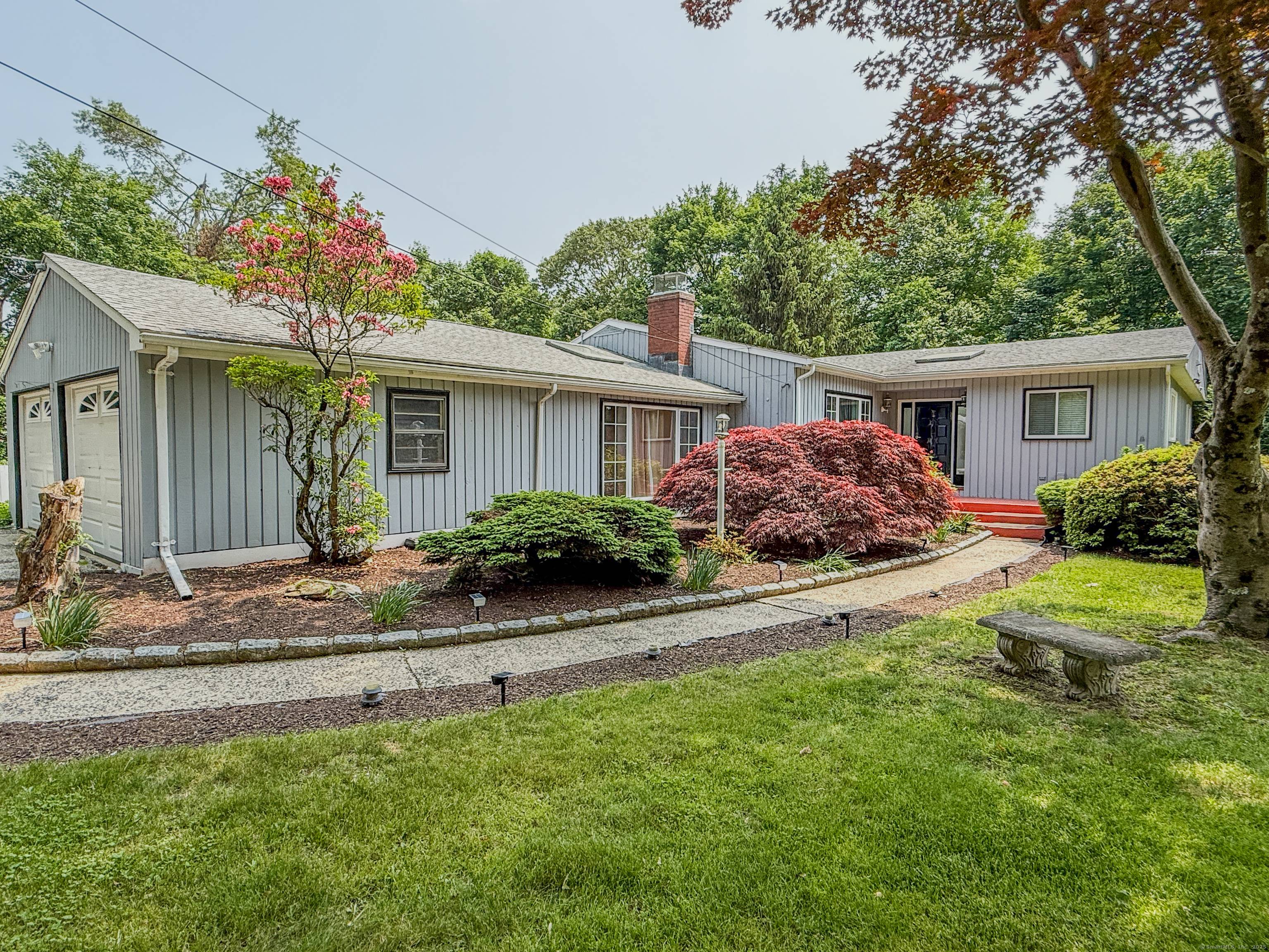 Welcome to this beautifully updated one level Ranch located near the Huntington Center Historic District, set on a flat and private 0.