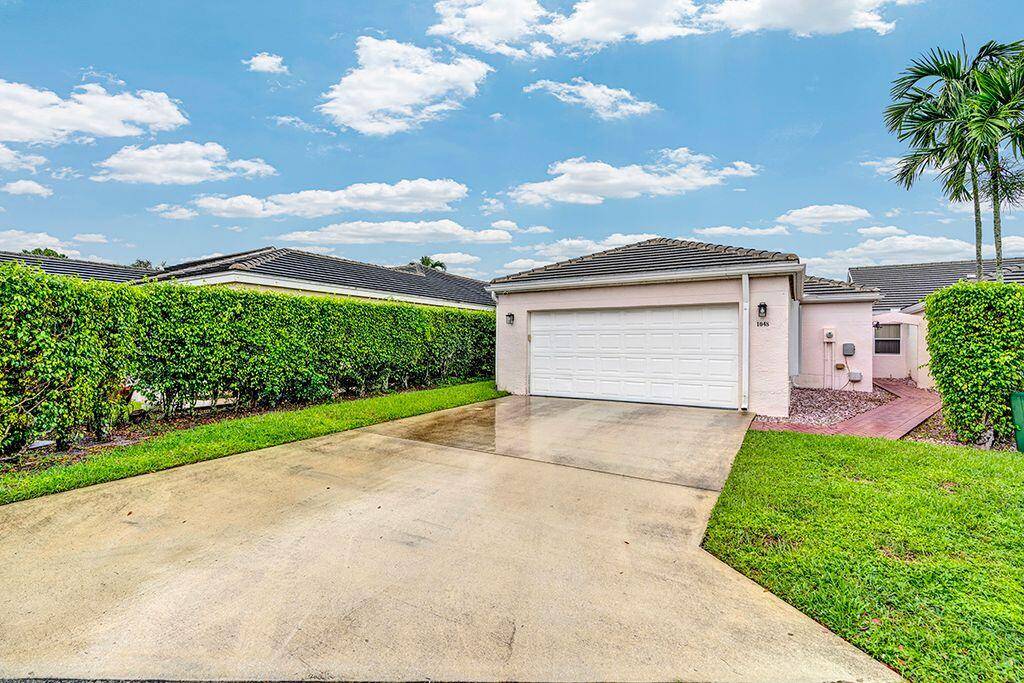 Wake up to breathtaking lake views in this beautifully updated 3 bedroom, 2 bath home in desirable Greenacres.