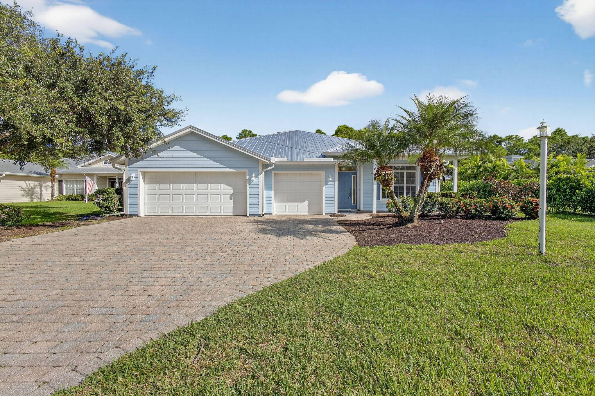Nestled in Little Kayak Point, on a tranquil cul de sac, sits this lovely, breezy blue Key West home with feel good, easy vibes.