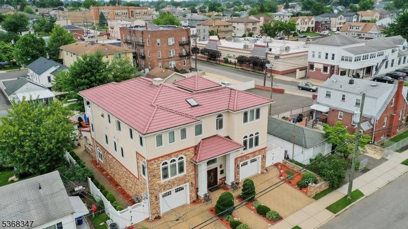 Welcome to this Exceptional Custom Built Two Family Home offering the Perfect blend of Modern Luxury, thoughtful Design Investment Versatility.