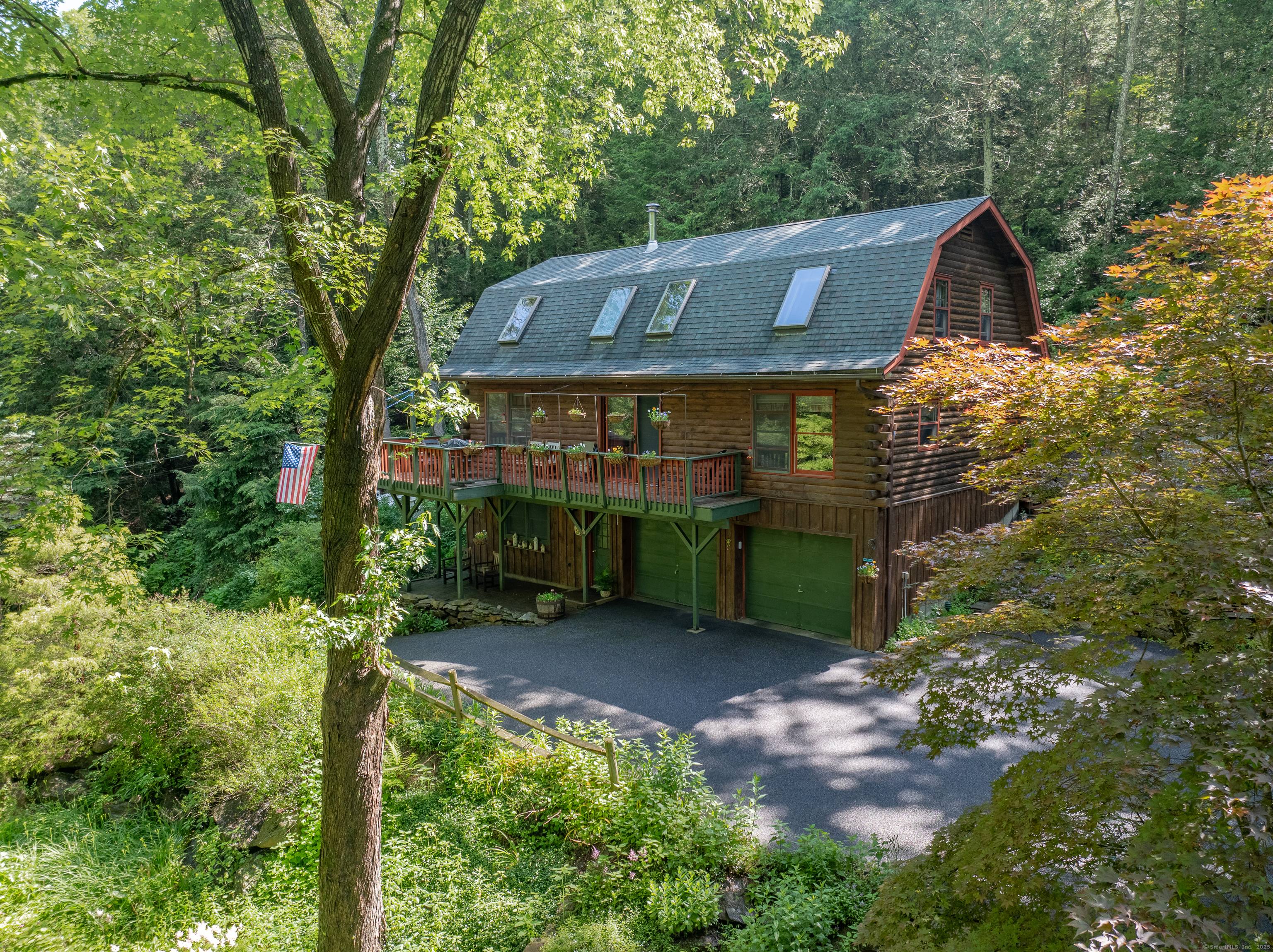 Nestled on 5. 04 acres of serene, park like grounds, this charming log cabin offers a perfect blend of seclusion, natural beauty, and year round comfort.