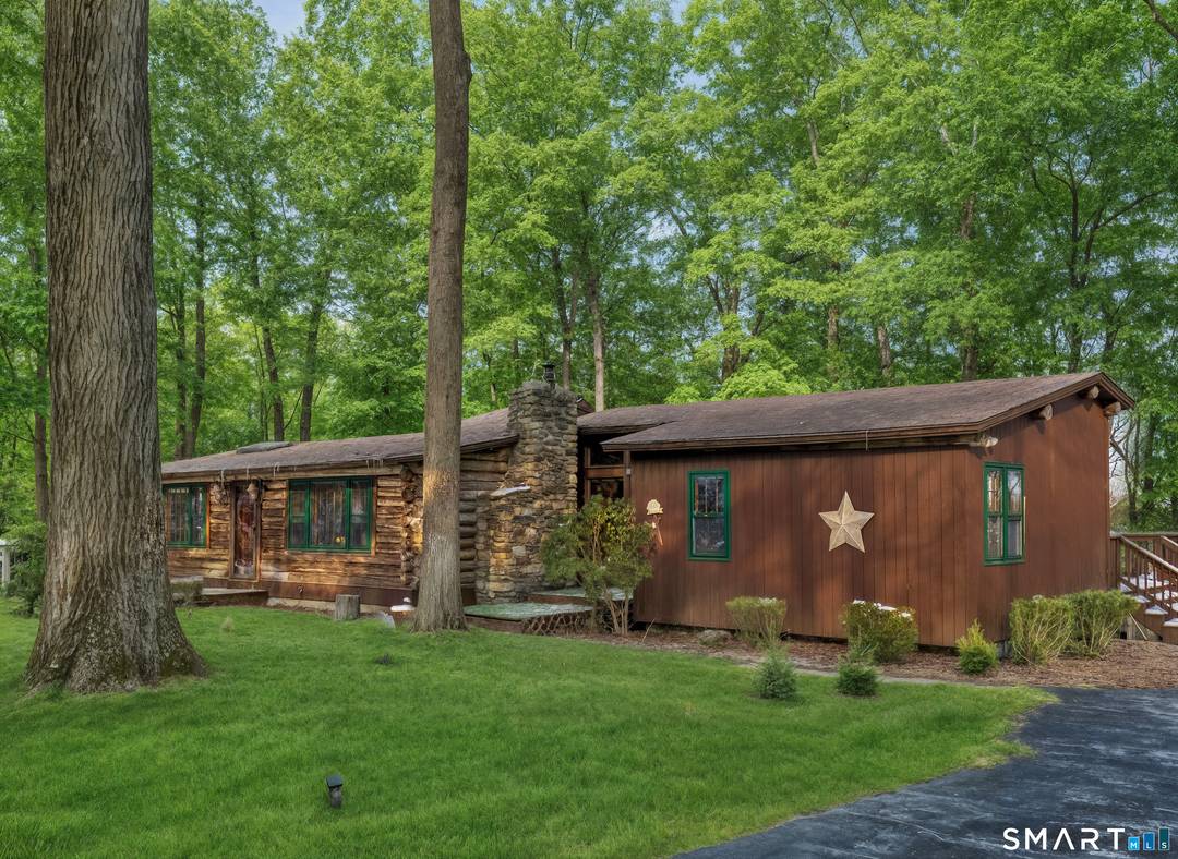 Discover this unique one of a kind 3 bedroom log cabin, perfectly tucked away on a private wooded country road bursting with rustic chic charm.