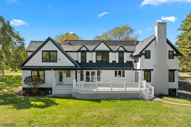 Welcome to a modern luxury estate perfectly situated on 2 acres in one of Mendham's most prestigious neighborhoods.