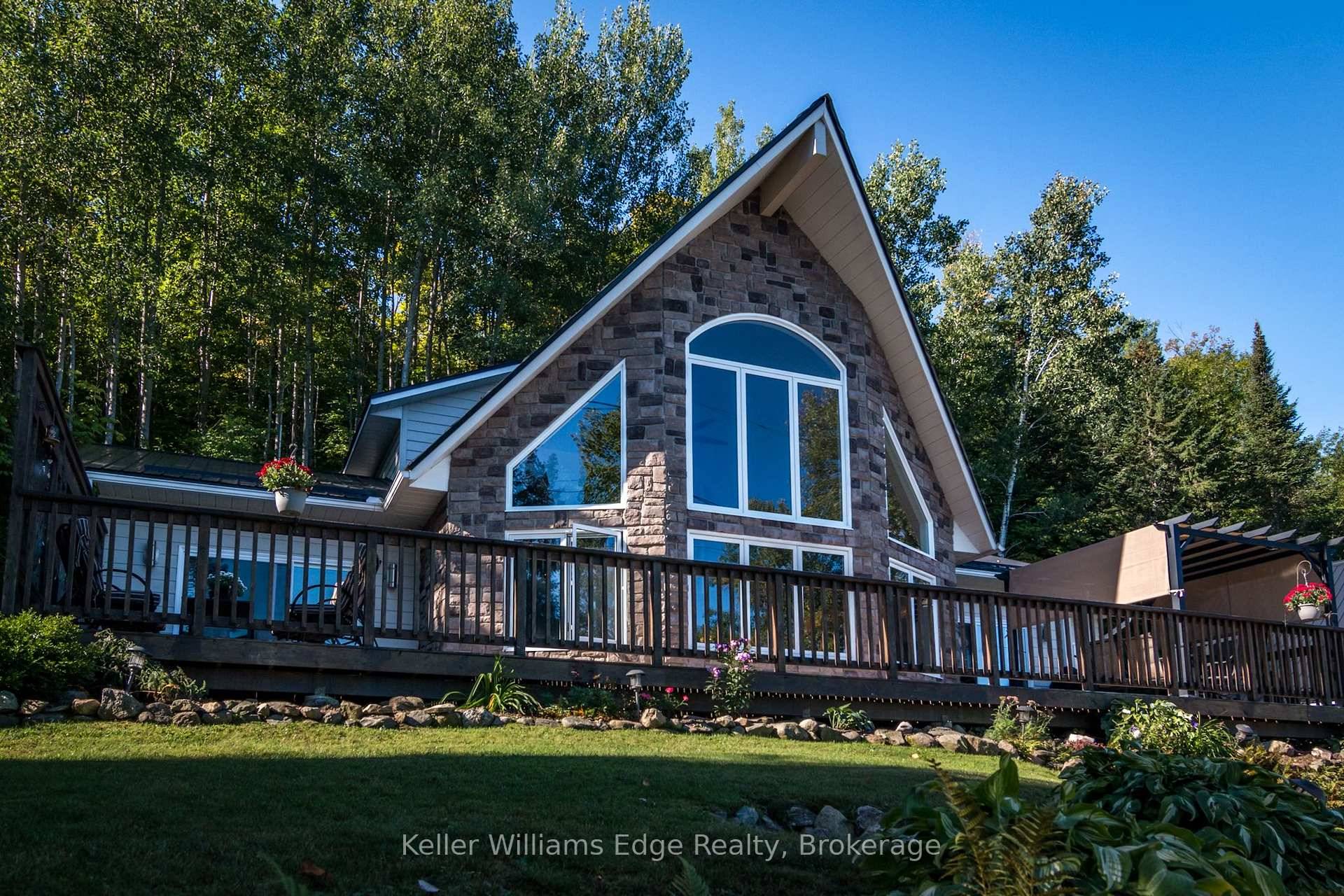 Absolutely Gorgeous Three Bedroom, Three Bathroom Home on the Beautiful Kamaniskeg Lake.