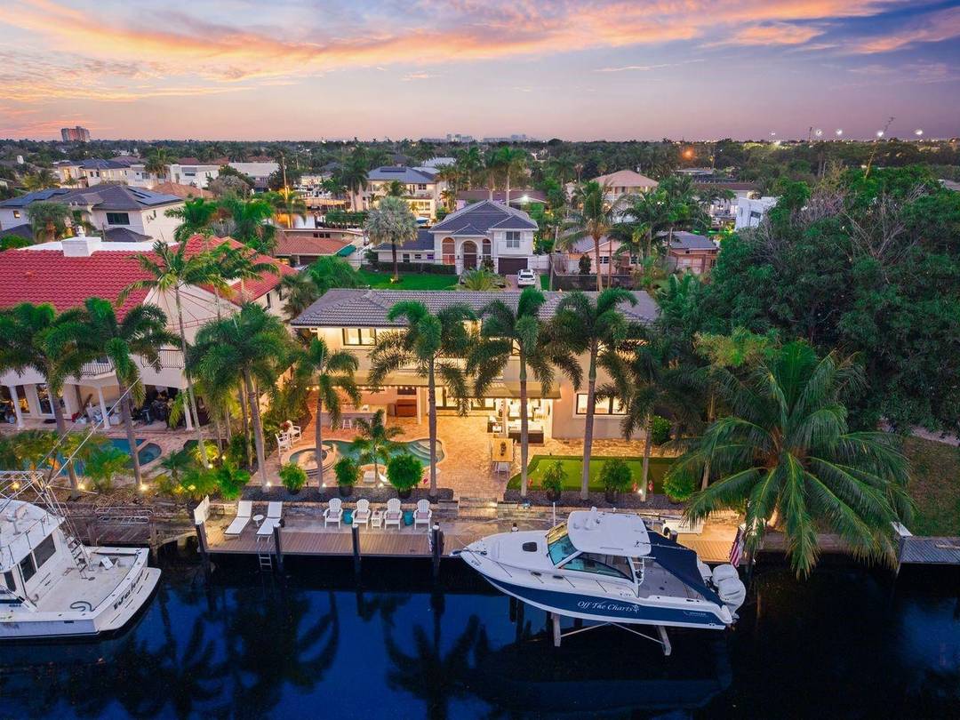 Experience the best of coastal living in this stunning Lighthouse Point waterfront home.