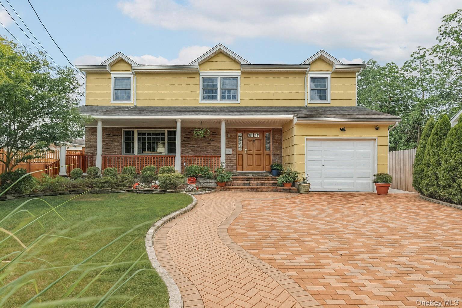 Enjoy peaceful moments on your welcoming front porch while tucked away on a quiet cul de sac, located in the desirable Village of Rockville Centre, with Oceanside schools, just minutes ...
