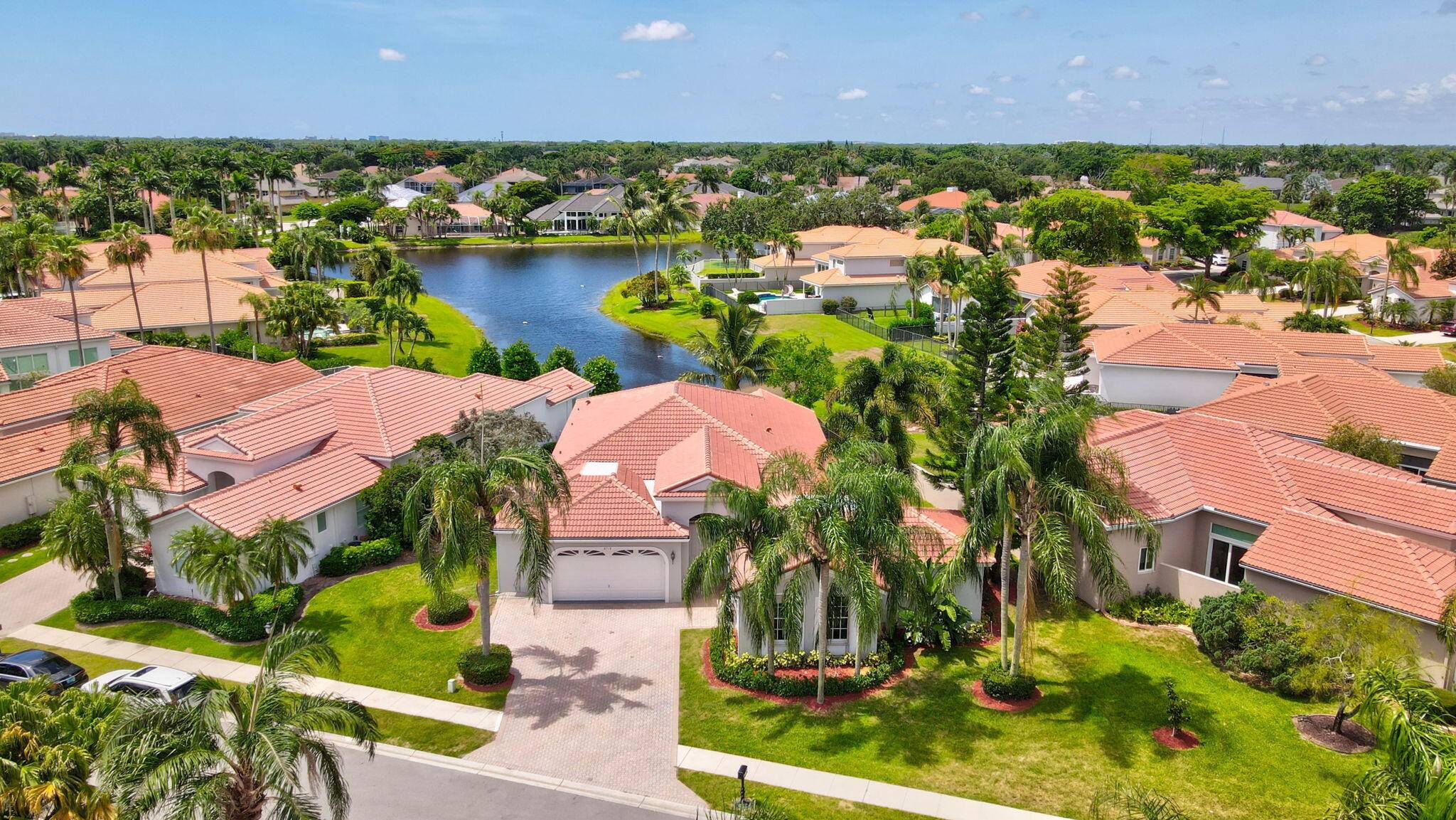 Welcome to Newport Bay Club, a highly desirable gated community in Boca Raton.