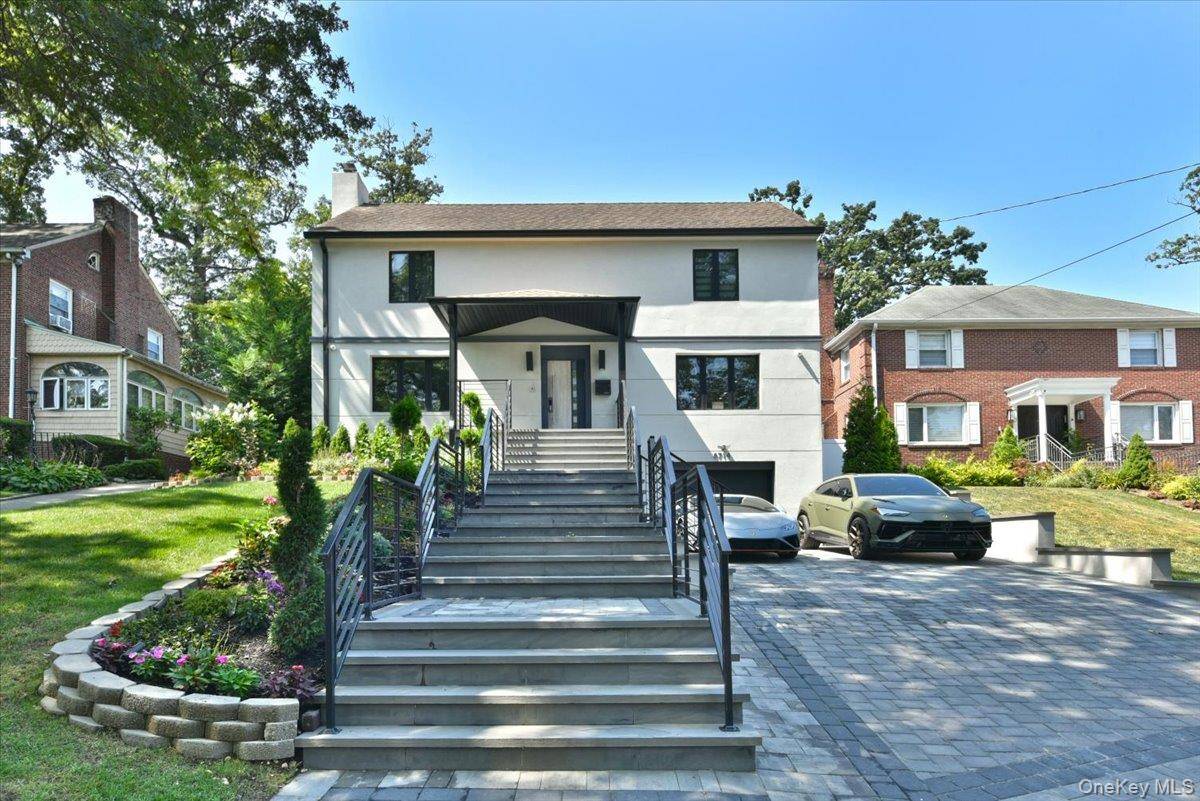 Welcome to this stunning, completely remodeled, custom designed modern colonial in Holliswood, finished to high end specifications in 2022.
