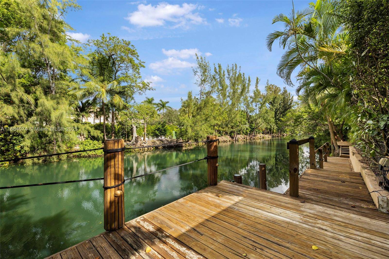 A Miami Signature Home Welcome to The Dockside Ranch in Coral Gables where Florida charm meets timeless elegance.
