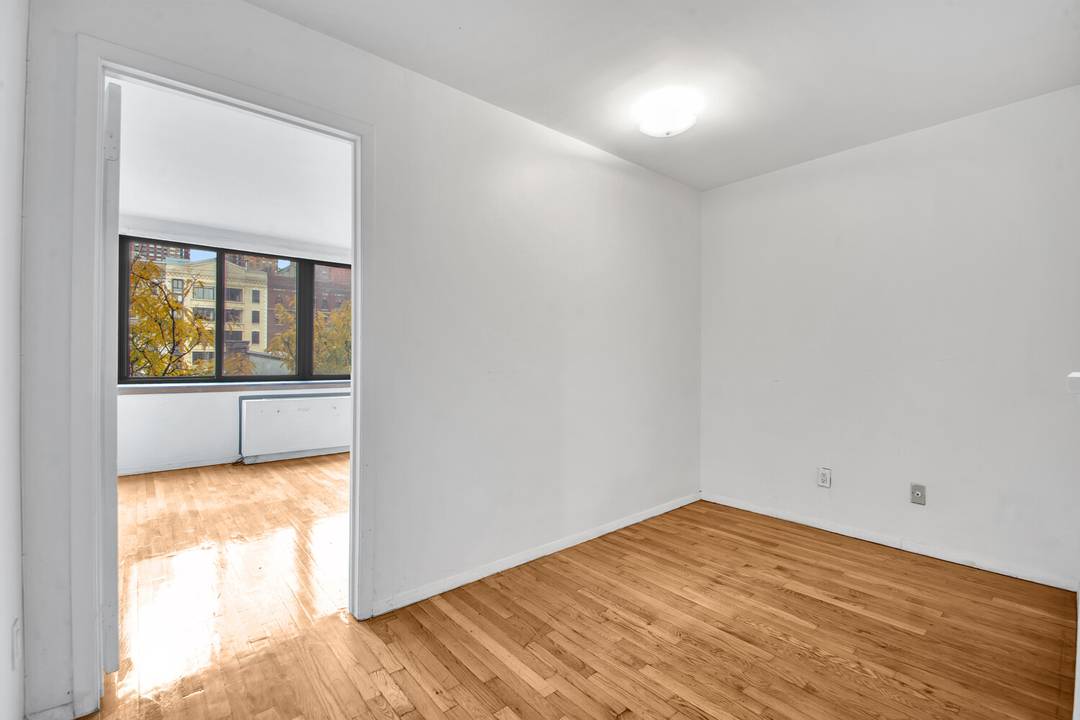 Bright and spacious one bedroom, one bath home offering approximately 660 square feet of well proportioned living space, highlighted by original hardwood floors, a functional galley kitchen, and a generously ...