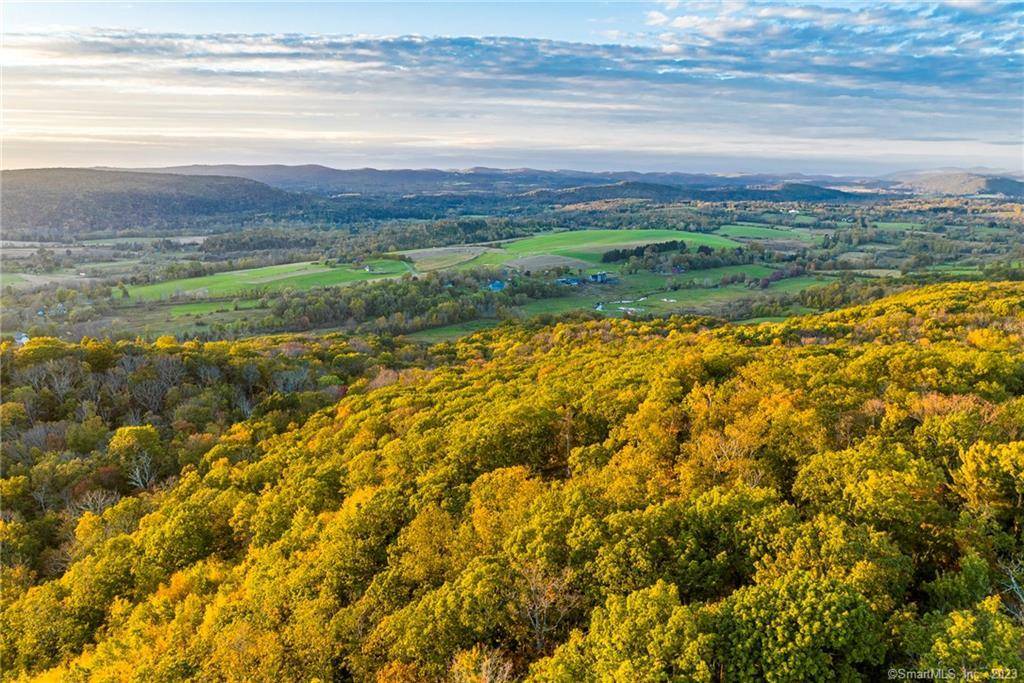 Just off Lambert Road, one of the finest country roads in Sharon, CT, with palatial views over Knibloe Road and the Oblong Valley, West to the Taconic Range, and North ...