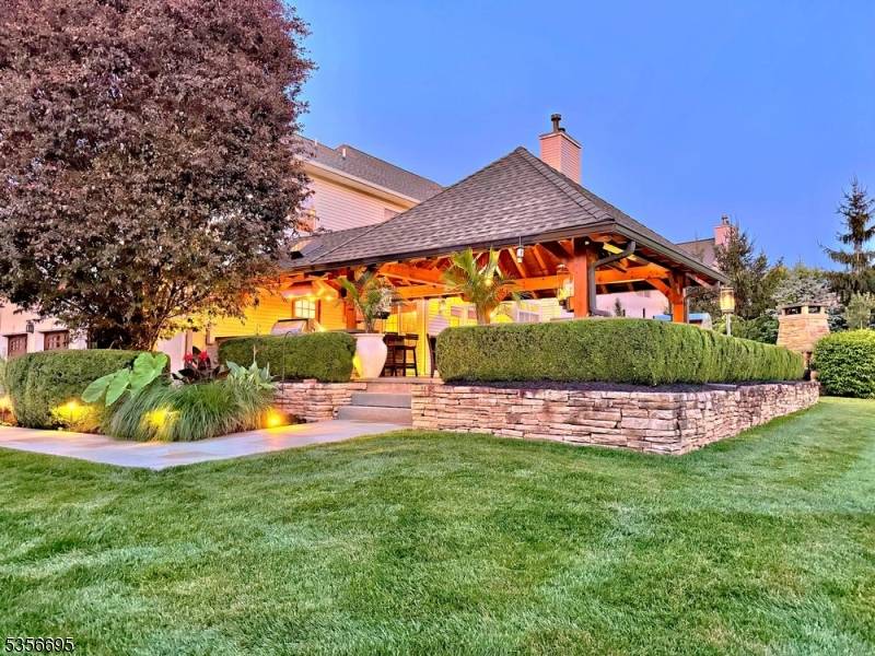 Elegant and timeless, this Kensington Colonial in prestigious Greenwood Meadows is nestled on a beautifully landscaped corner lot just shy of an acre.