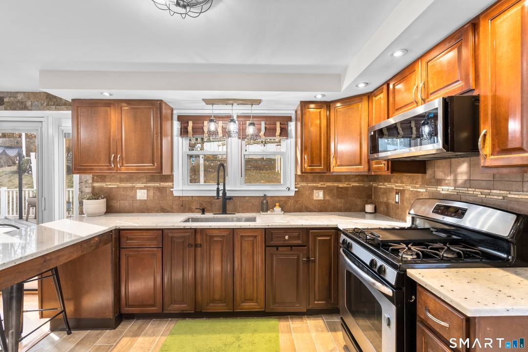 Charming 3 bedroom ranch with all of the bells and whistles.