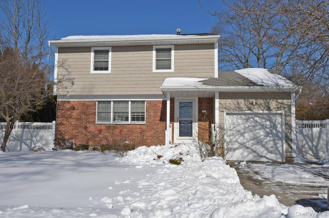 Stunning three bedroom Colonial showcasing gleaming hardwood floors throughout, central air conditioning, and upgraded electrical.