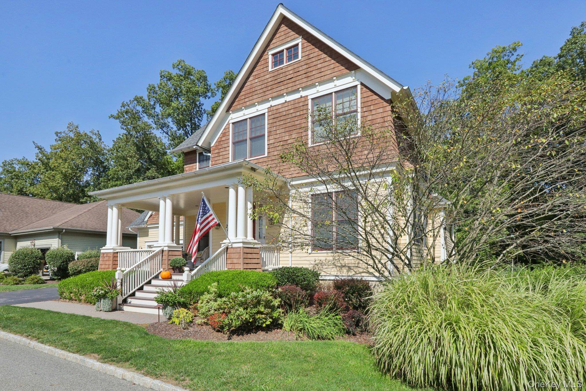 This traditional style home with a touch of Arts amp ; Crafts design welcomes you with a wraparound front porch perfect for relaxing.