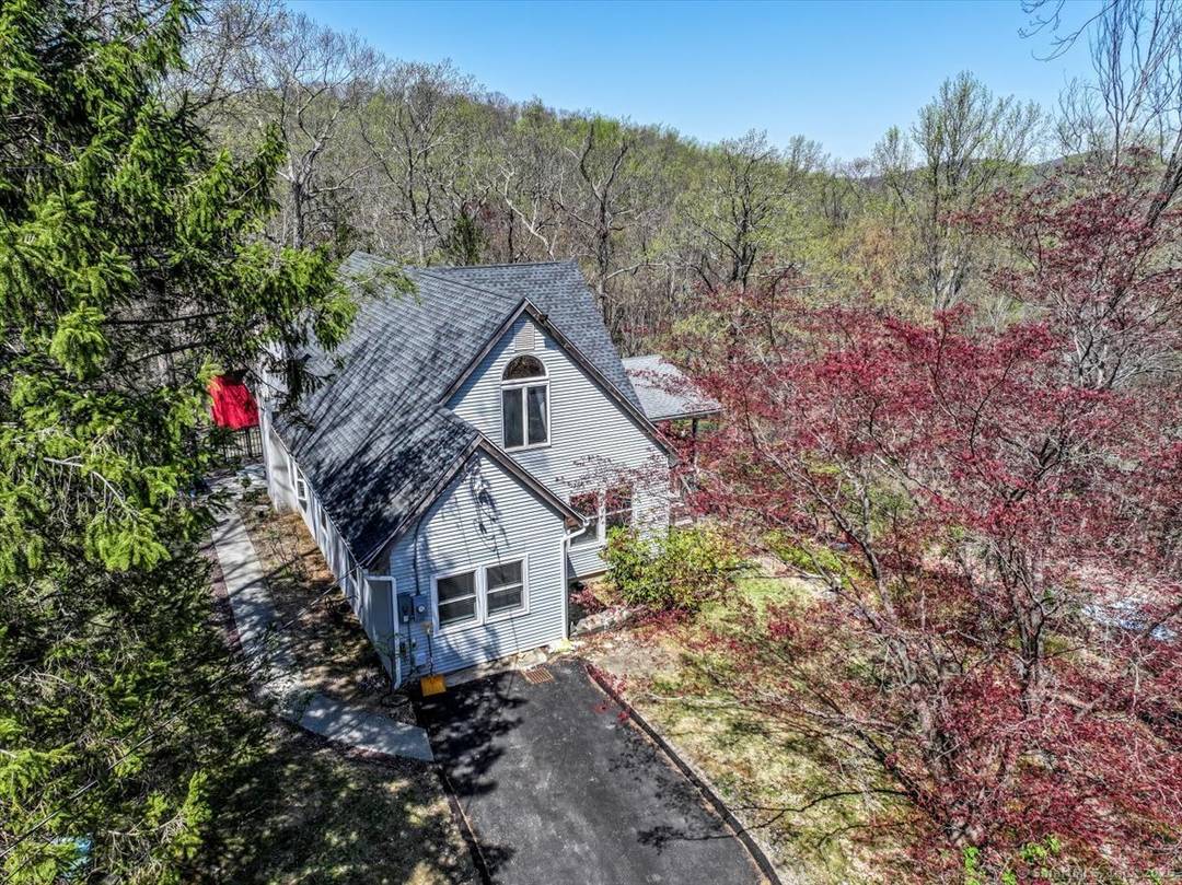 Tucked away at the private end of a cul de sac in desirable Sherman and just minutes from Candlewood Lake, this charming Cape offers great space, and a peaceful setting ...