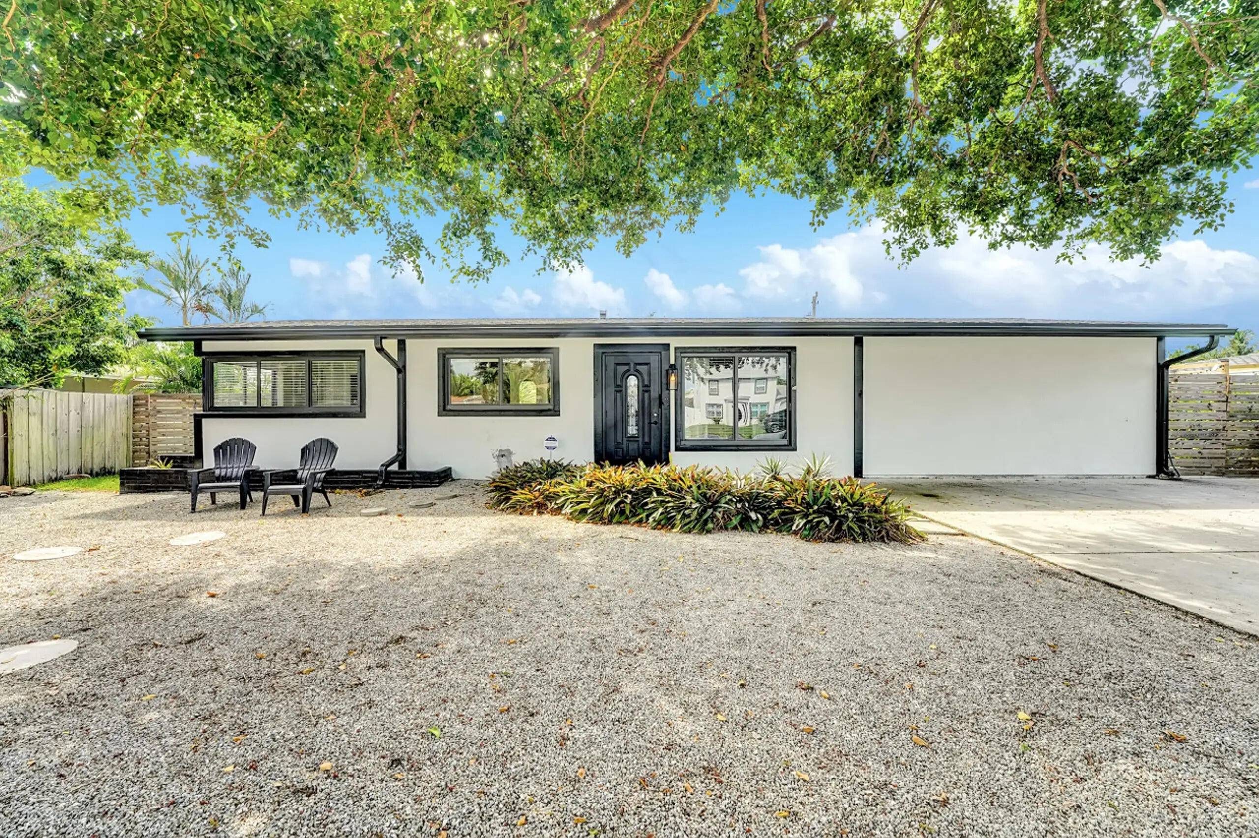 Discover the perfect blend of coastal luxury and modern comfort in this stunningly remodeled 4 bedroom, 2 bath Boca Raton home.
