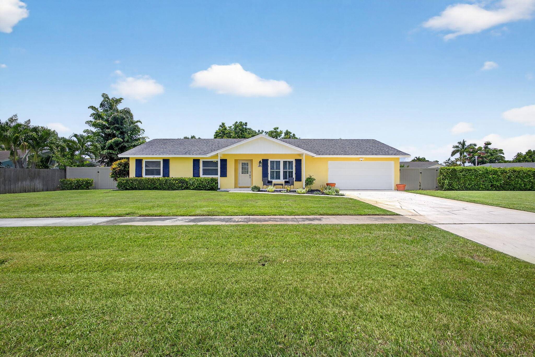 Welcome to this beautifully updated 3 bedroom, 2 bathroom pool home in Wellington !