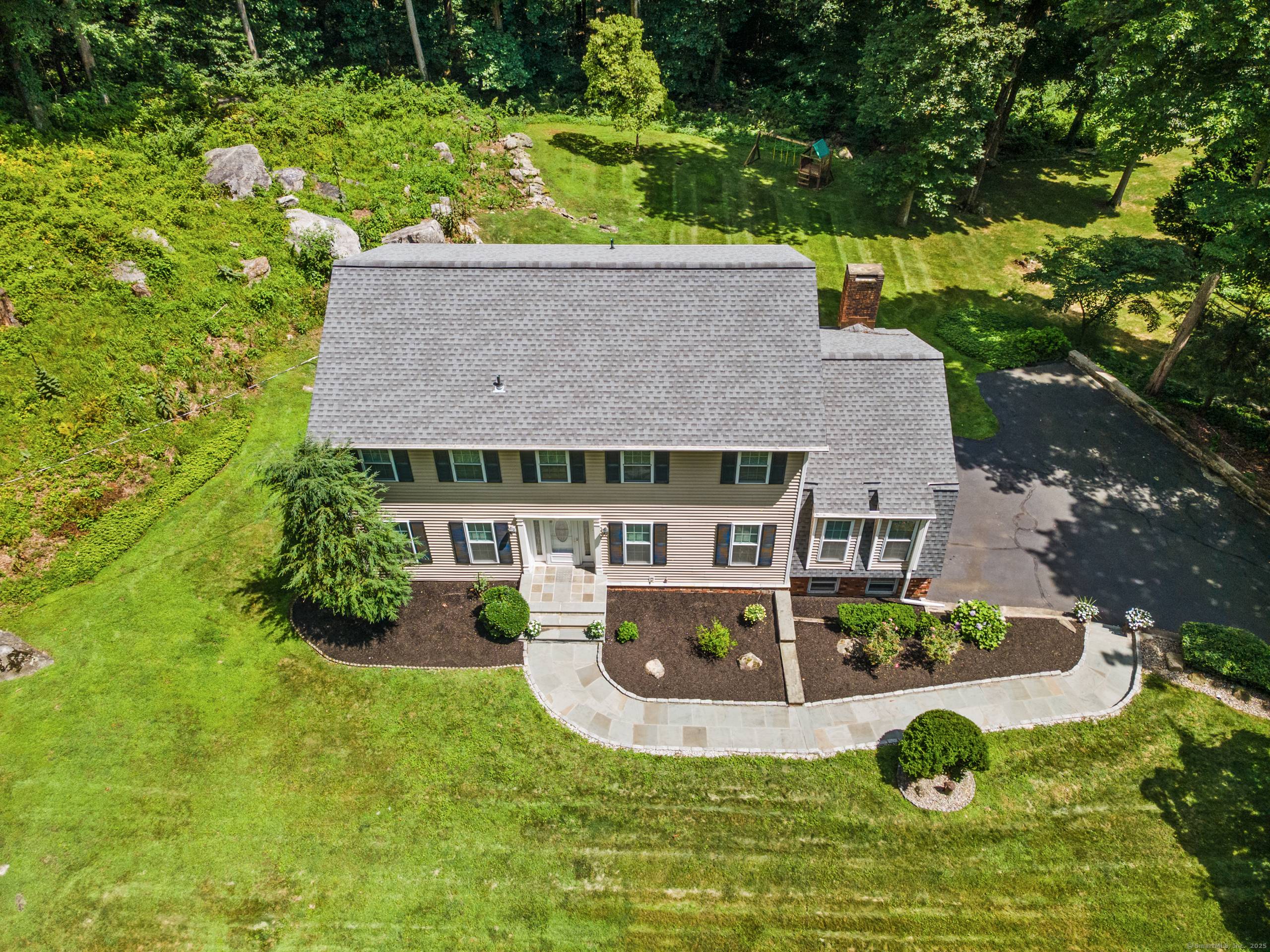 Embraced by timeless stone walls, this beautifully updated home sits on a level lot that's absolutely gorgeous, private, and brimming with charm and peaceful serenity in the sought after Aunt ...