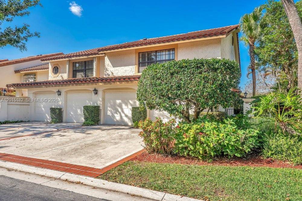 Welcome home to this fully remodeled Mediterranean style townhome in the heart of Boca Raton, located directly on the golf course in the beautiful La Mirada at Boca Pointe community.