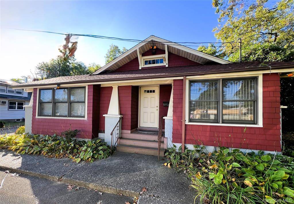 Presenting a rare opportunity to own a charming Craftsman style building, Circa 1922, situated on a prominent corner lot along Middle Country Road.