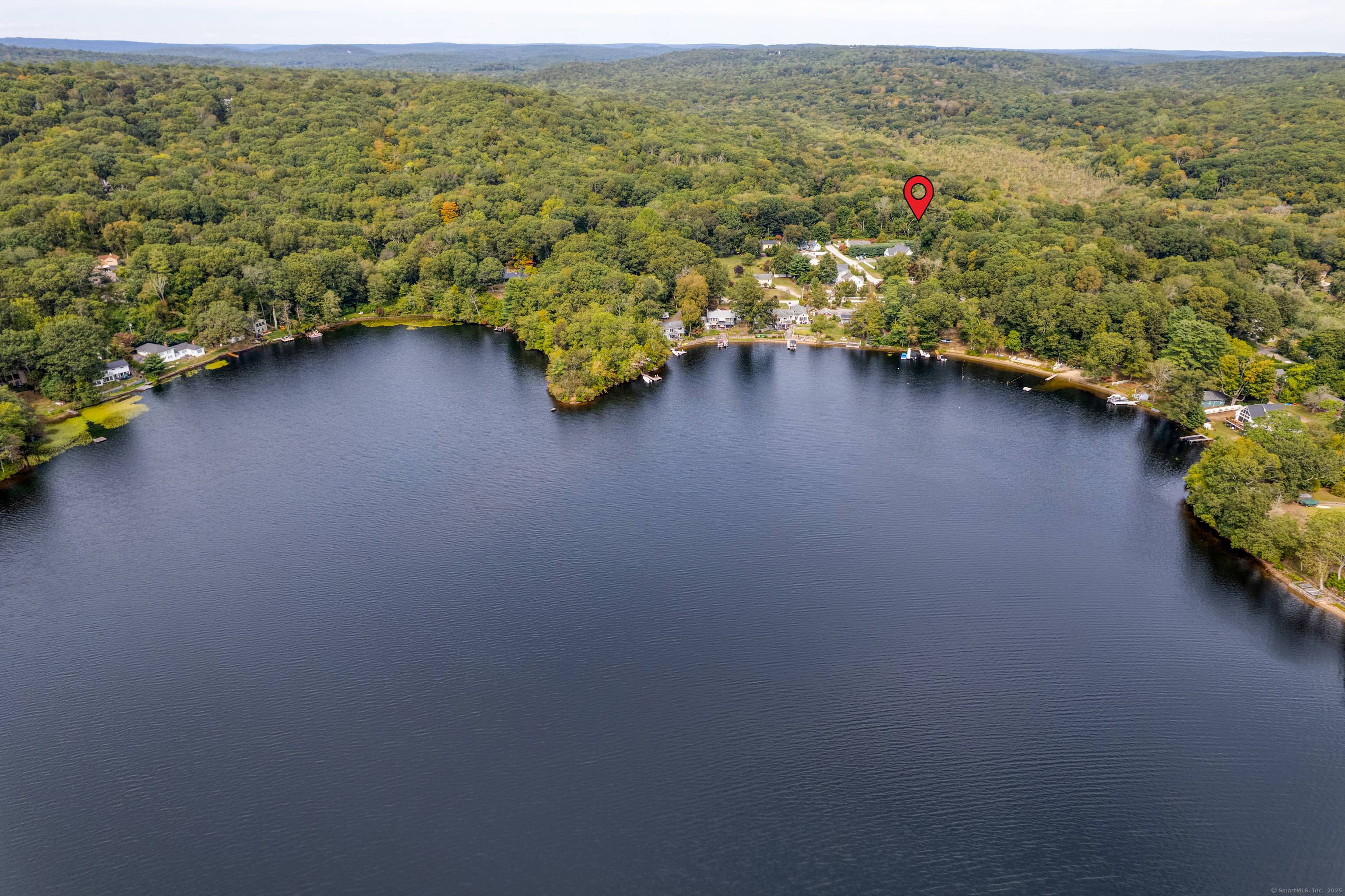 Just one block from your Sandy Beach Association on Rogers Lake, this expanded ranch offers a relaxed lifestyle in a highly desirable setting.