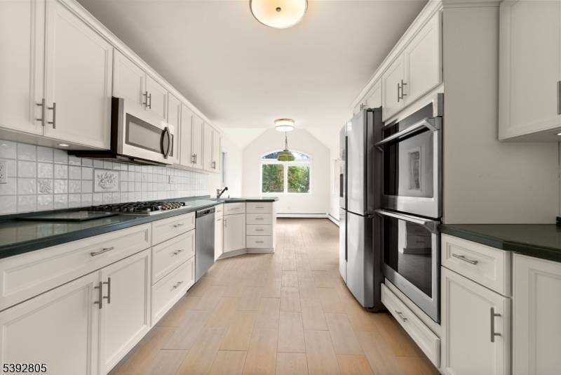 This 4 bed, 4 bath custom home offers the perfect blend of modern living and commuter convenience.
