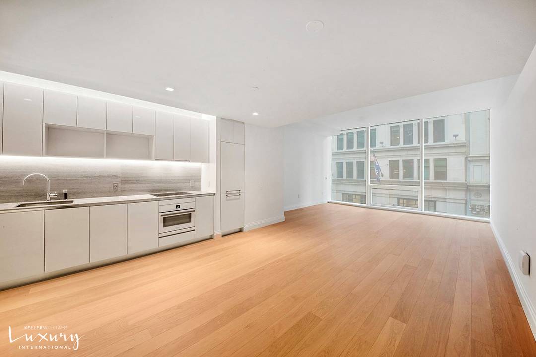 This expansive and loft like apartment, located in an iconic recently converted Art Deco condominium in the Financial District, has massive floor to ceiling windows overlooking Broadway with a view ...