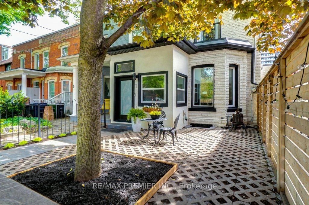 Discover the gorgeous 1 Gwynne a beautifully renovated end unit townhouse like a semi on a tree lined street that effortlessly blends historic character with modern luxury.