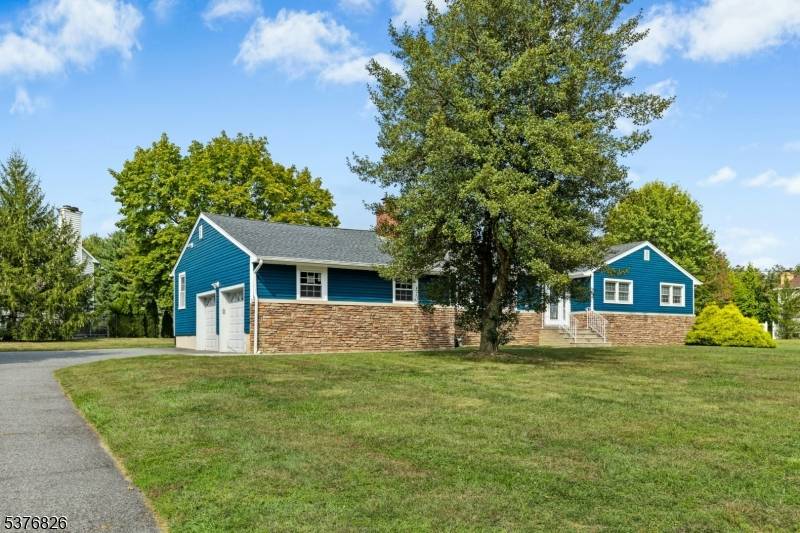 Welcome to 1701 Raritan Road a beautifully expanded ranch nestled on nearly a full acre in desirable Scotch Plains.