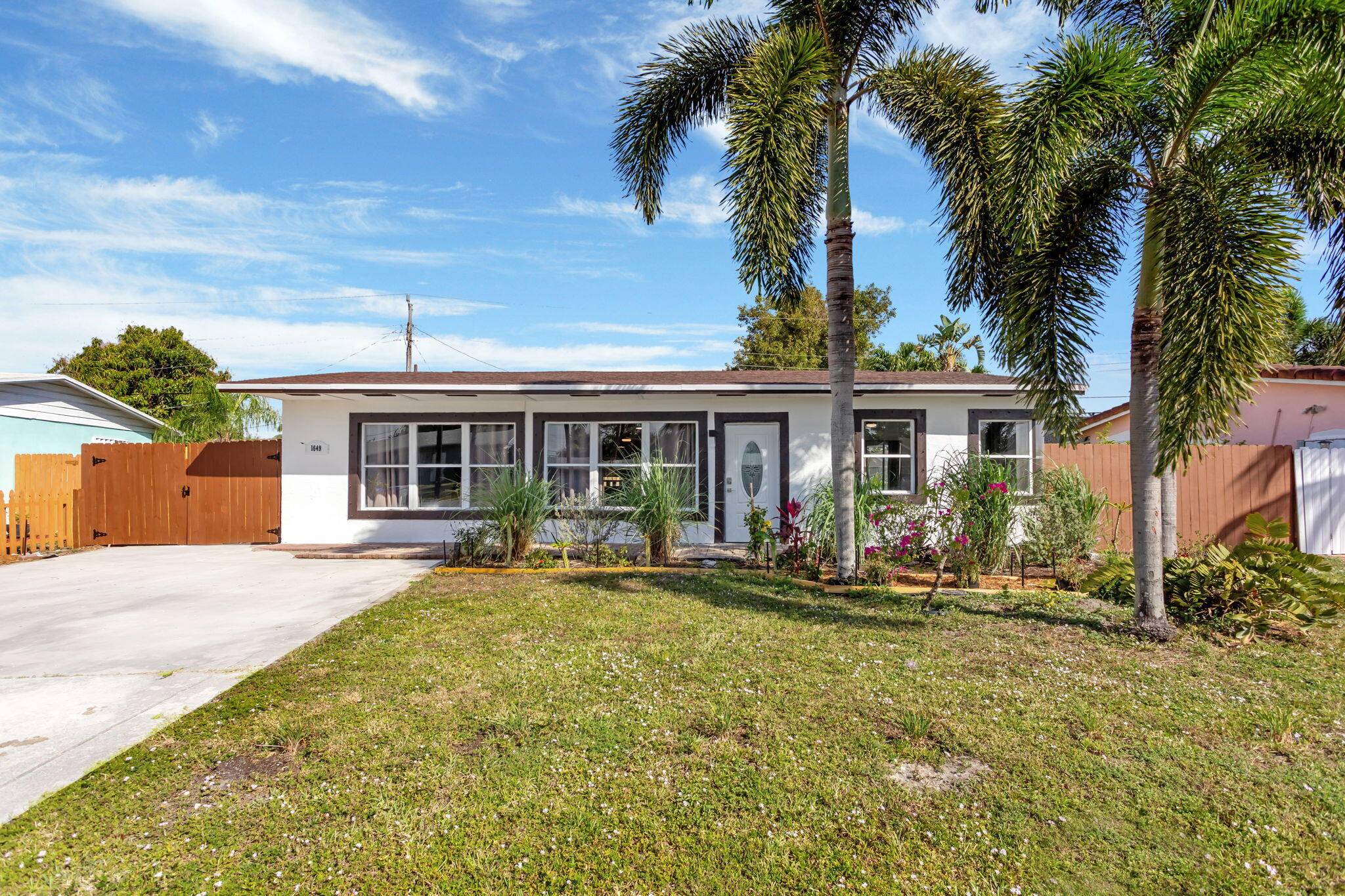 This beautiful home features a modern kitchen with wood countertops, stainless steel appliances, and an accent backsplash.