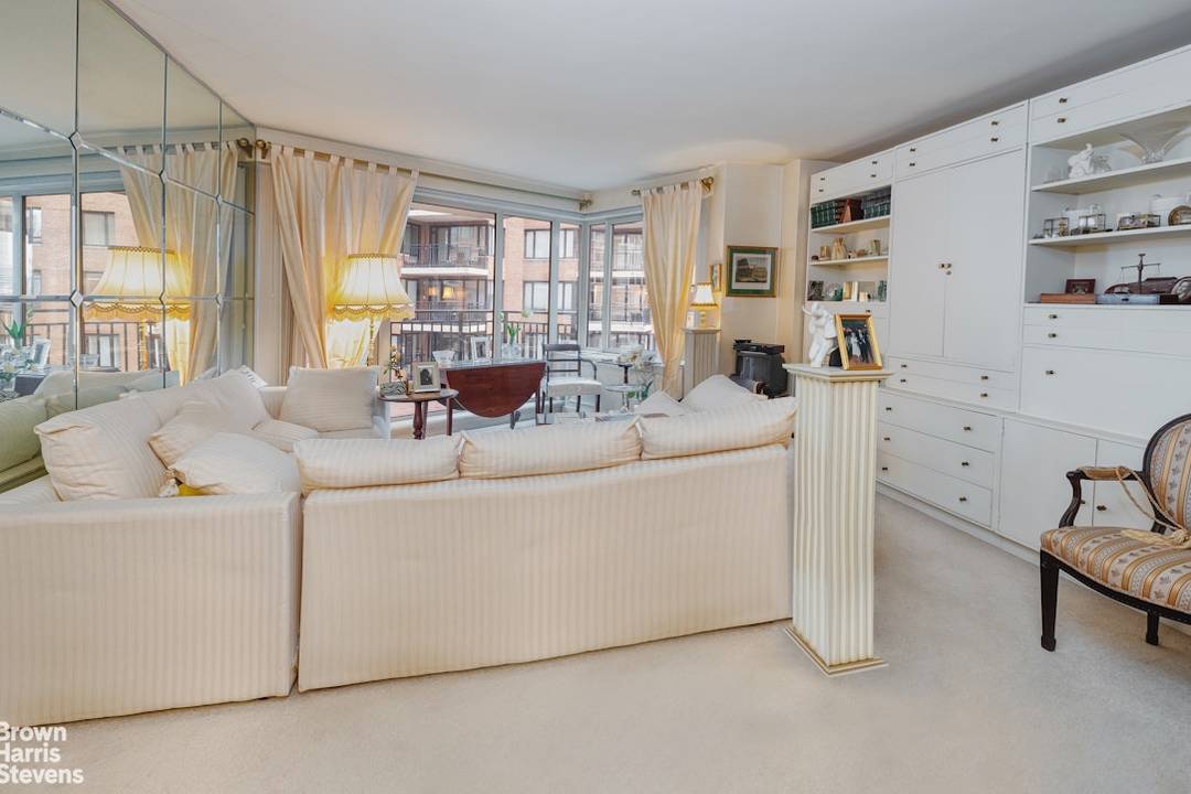 Sunny and spacious one bedroom home in Sutton Place's best post war building.