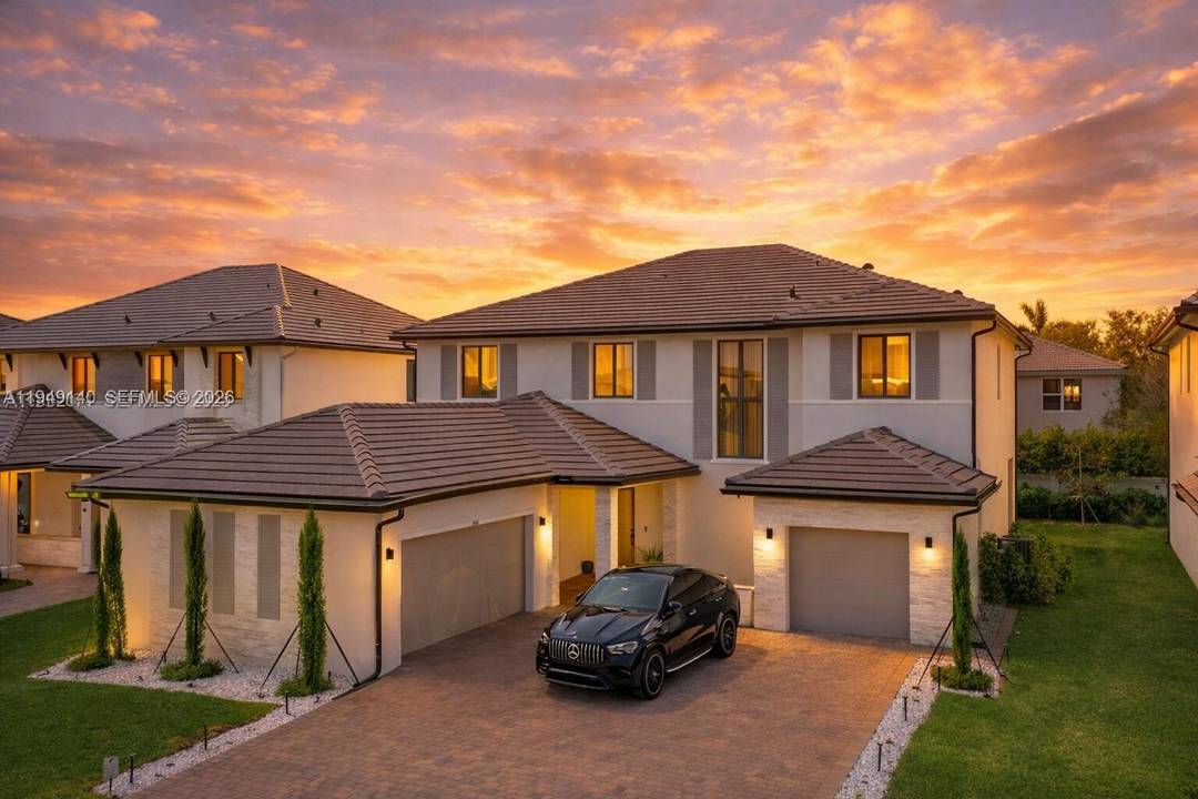 Step into refined living at this stunning home in the gated Marbella Miramar community.