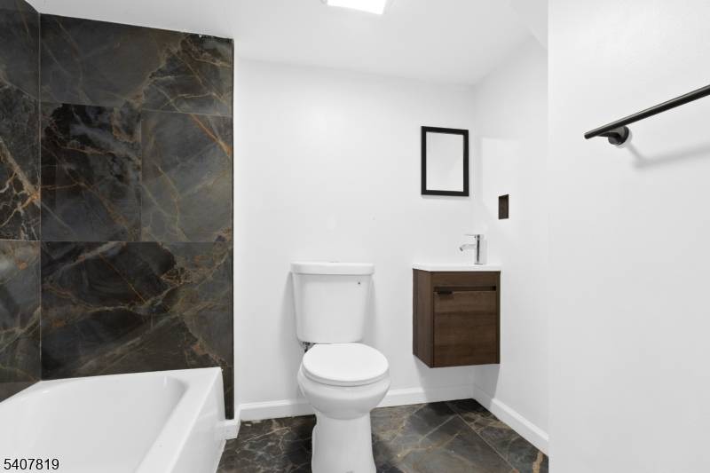 Welcome to this renovated 4 bedroom, 4 bath Colonial located on a quiet block in Newark ?