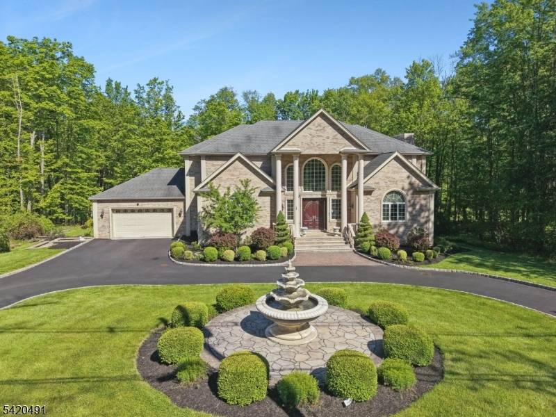 An exceptional 4 bed, 4. 5 bath colonial on 6 acres of private landscaped grounds.