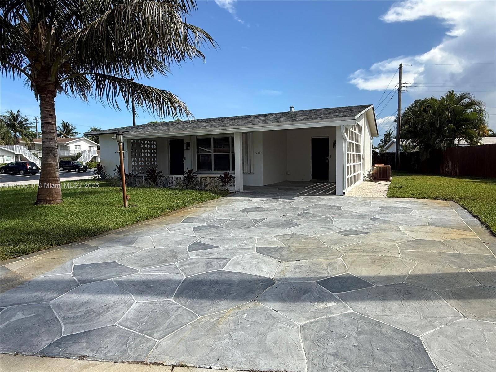 2022 Permitted Remodel Move In Ready Cresthaven Home in Pompano Beach fenced yard.