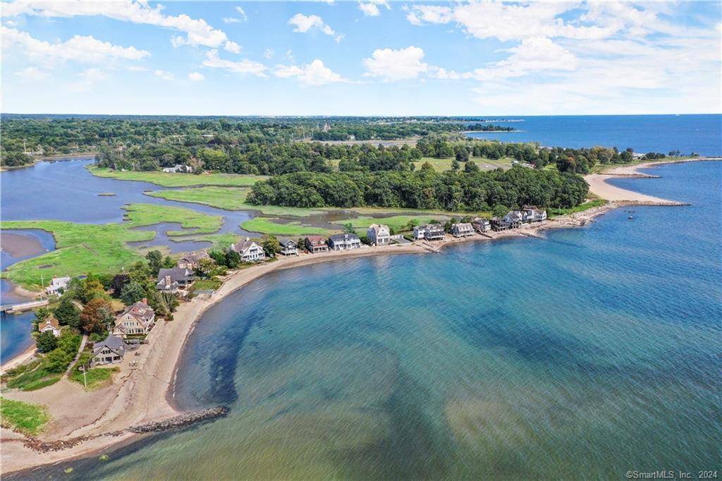 DIRECT WATERFRONT WITH 100' of PRIVATE BEACHFRONT AND RARE OPPORTUNITY TO BUILD A STUNNING HOME ON COMPO MILL COVE WITH A POOL.