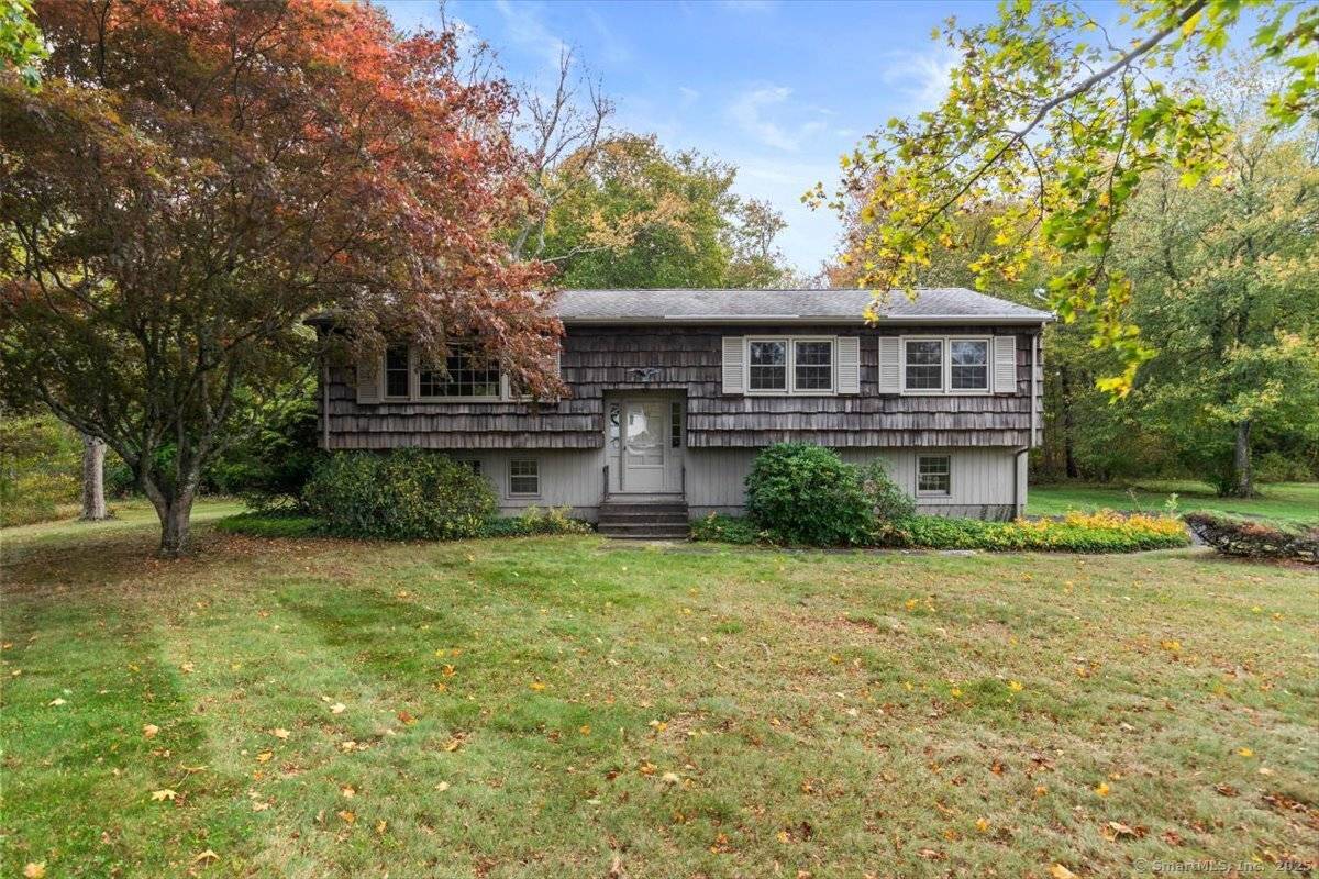 Nestled in the desirable Grassy Hill Golf Course neighborhood, this lovingly maintained raised ranch is ready for its next chapter.