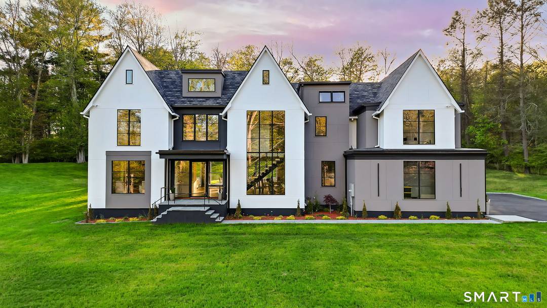 Discover exceptional modern living in this stunning new construction home set on 1.