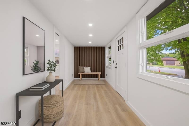 Welcome home to this beautifully renovated retreat at 9 Anderson Place in Budd Lake where modern luxury meets tranquil privacy.