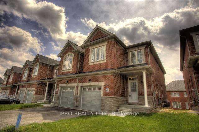 End unit linked 2 storey townhouse only the garage is attached.