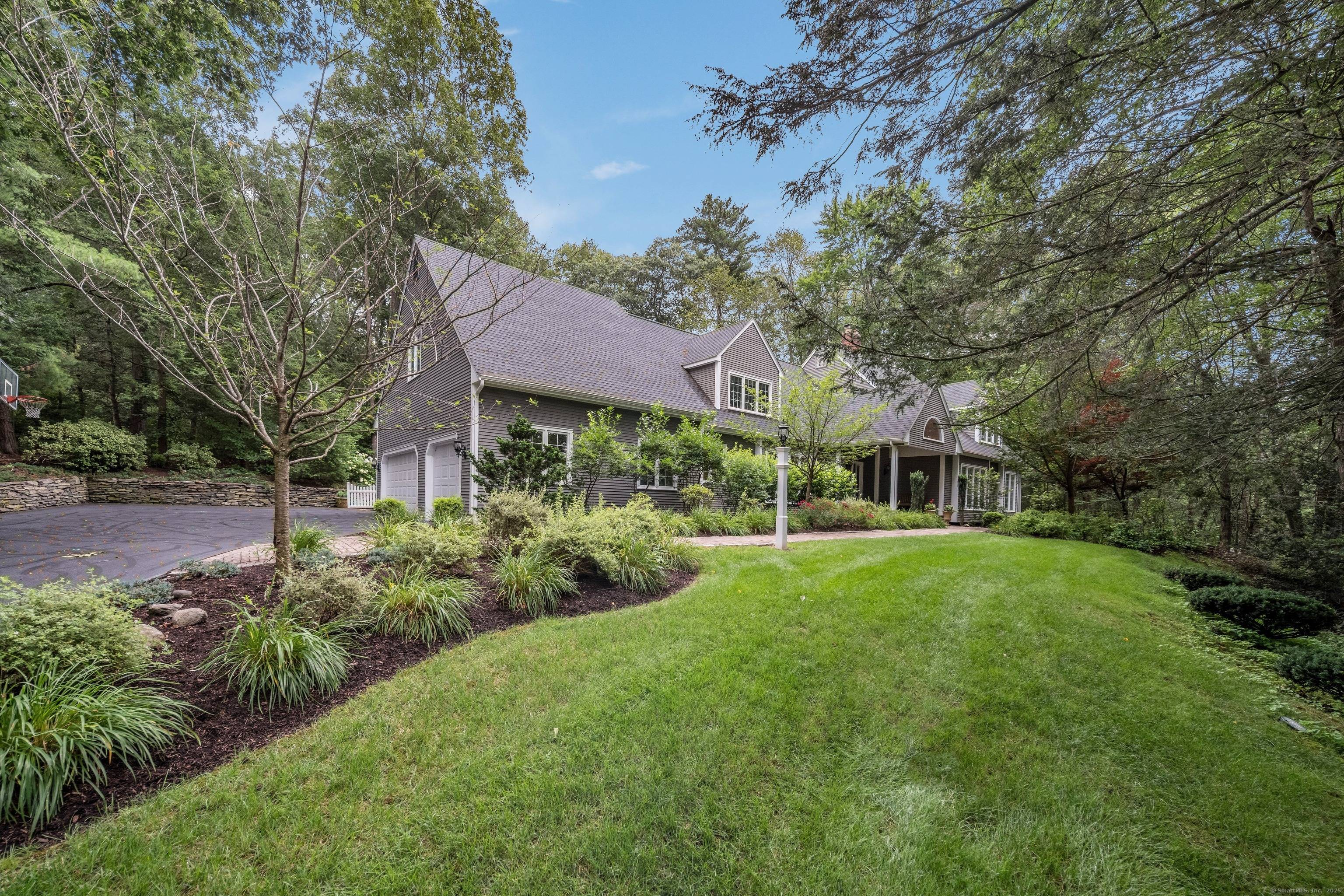 Beautifully updated 5 bedrm Cape style home privately set on a lushly landscaped acre on sought after Henley Way, Avonridge's premier location.