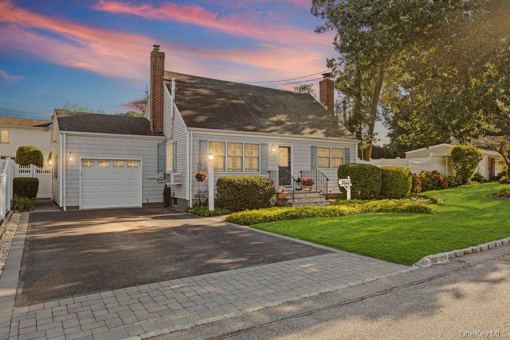 This charming 4 bedroom Cape style home exudes warmth and timeless elegance, nestled on a beautifully landscaped property that feels like a serene park.