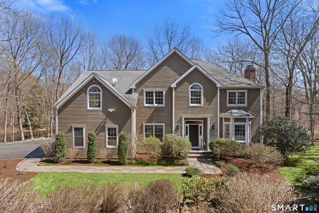 Set in the highly desirable Cranbury neighborhood on the Wilton border, this light filled 5BR Colonial offers privacy, elegance, and exceptional convenience just 10 minutes to Westport center.