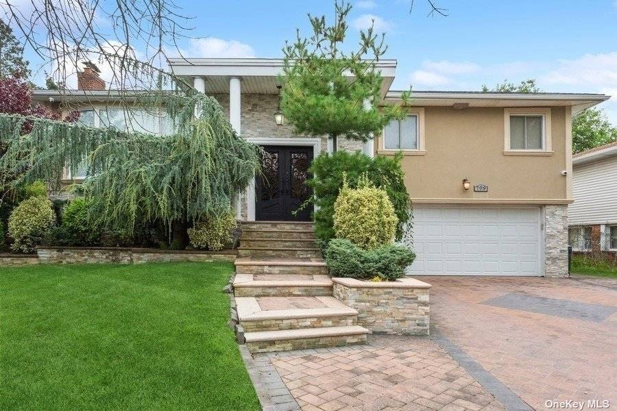 Welcome to this stunning 4 bedroom, 3 bathroom Hi Ranch in the heart of North Woodmere.